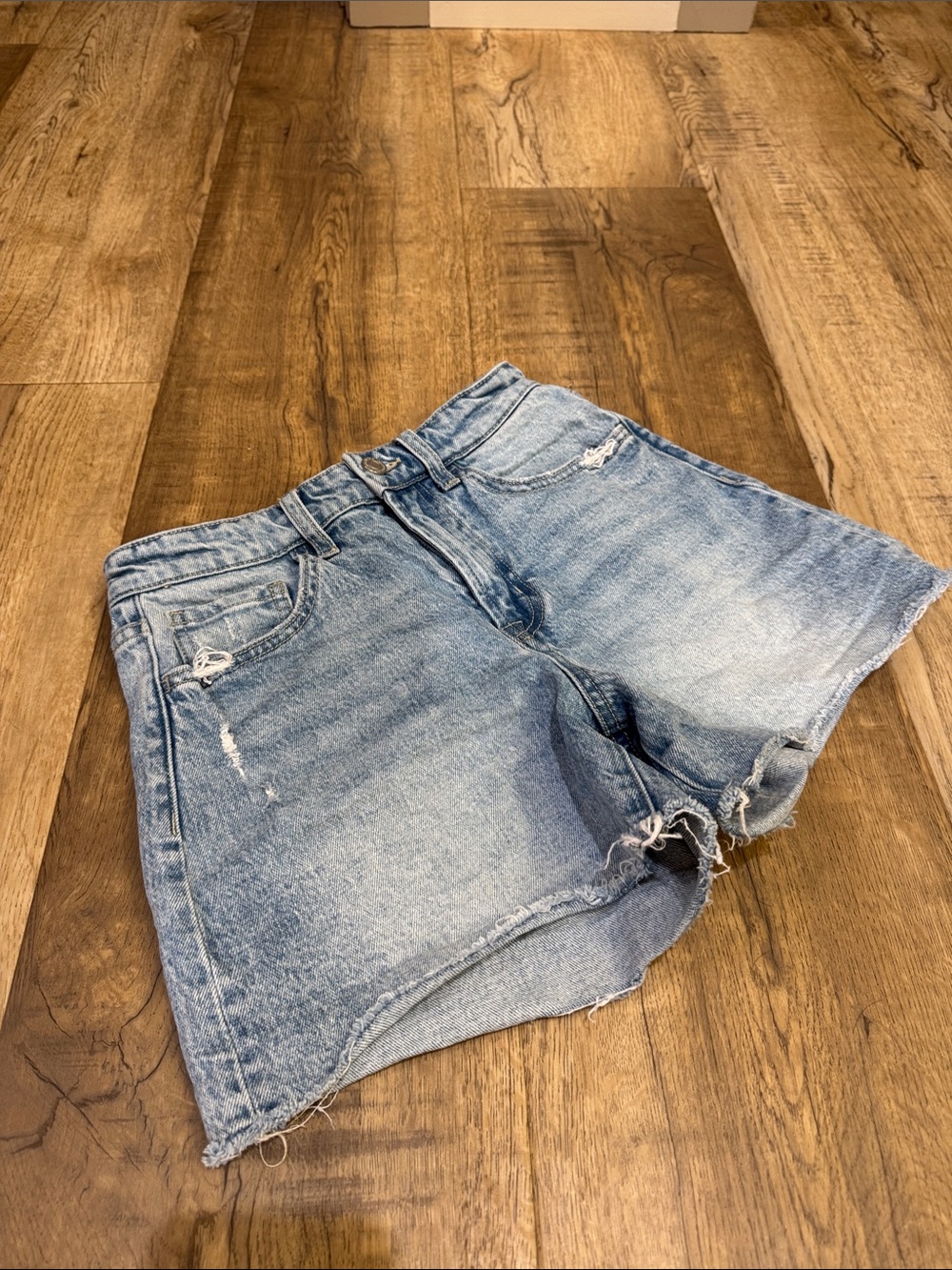 High-Rise Light Blue Distressed Denim Shorts